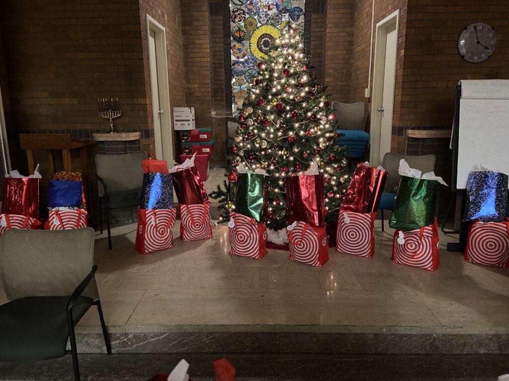 gift bags around tree in great hall at POWER House